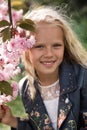 Beautiful little child girl with sakura flowers Royalty Free Stock Photo
