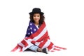 beautiful little child sitting on floor covered in usa flaf