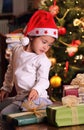 Beautiful little child with xmas gifts