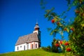 Beautiful little church in Alps. Sunny day, green grass on the h Royalty Free Stock Photo