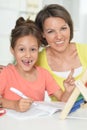 Beautiful little cute girl reading book with mother Royalty Free Stock Photo