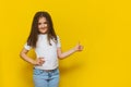 Beautiful little fashion model on Yellow studio background Royalty Free Stock Photo