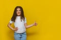 Beautiful little fashion model on Yellow studio background Royalty Free Stock Photo