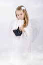 Beautiful little girl angel with a book Royalty Free Stock Photo