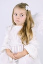 Beautiful little girl angel with a book Royalty Free Stock Photo