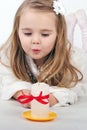 Beautiful little girl angel with a candle Royalty Free Stock Photo