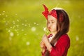 Beautiful little girl blowing dandelion Royalty Free Stock Photo