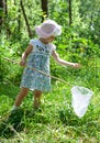 Beautiful little girl with butterfly net in a park Royalty Free Stock Photo