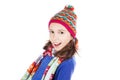 Beautiful little girl in cap and scarf