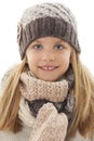 Beautiful little girl in cap and scarf. Winter style Royalty Free Stock Photo