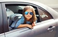 Beautiful little girl child sitting in car, looking out window Royalty Free Stock Photo