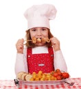 Little girl cook eat grilled chicken meat Royalty Free Stock Photo