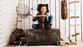 Beautiful little girl in cowboy hat with drum Royalty Free Stock Photo