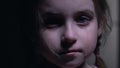 Beautiful little girl crying, defenseless victim of kidnapping, child abuse