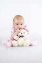 Beautiful little girl with cuddle-bear. Royalty Free Stock Photo