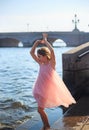 Beautiful Little Girl is dancing with waves at sunset.  Summer Sunny Day,  happy Kids concept Royalty Free Stock Photo