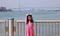 Beautiful little girl at Detroit Michigan, high definition picture of the Ambassador bridge between USA and Canada Royalty Free Stock Photo