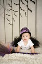 Beautiful little girl with Down syndrome in a suit a little witch Royalty Free Stock Photo