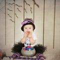 Beautiful little girl with Down syndrome in a suit a little witch Royalty Free Stock Photo