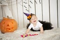 Beautiful little girl with Down syndrome in a suit a little witch Royalty Free Stock Photo