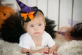 Beautiful little girl with Down syndrome in a suit a little witch Royalty Free Stock Photo