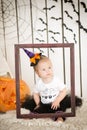 Beautiful little girl with Down syndrome in a suit a little witch Royalty Free Stock Photo