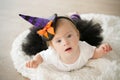 Beautiful little girl with Down syndrome in a suit a little witch Royalty Free Stock Photo