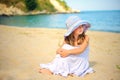 Beautiful little girl in dress and beach hat Royalty Free Stock Photo