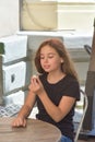 Beautiful little girl eating coconut candy