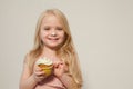 Beautiful little girl eating sweet candy lollipop cake Royalty Free Stock Photo