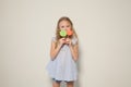 Beautiful little girl eating sweet candy lollipop cake Royalty Free Stock Photo