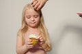 Beautiful little girl eating sweet candy lollipop cake Royalty Free Stock Photo