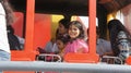 Beautiful Little Girl Enjoying a Flying Bus Ride