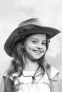 Beautiful little girl in fashion cowboy hat has happy face Royalty Free Stock Photo