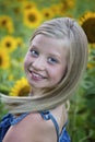 Beautiful little girl in front of sunflower field Royalty Free Stock Photo