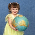 Beautiful little girl with globe Royalty Free Stock Photo