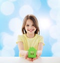 Beautiful little girl holding paper house cutout Royalty Free Stock Photo