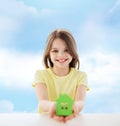 Beautiful little girl holding paper house cutout Royalty Free Stock Photo