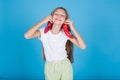 Beautiful little girl holds two red peppers Royalty Free Stock Photo