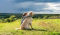 Beautiful little girl hugging loyal dog