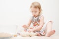 Beautiful little girl learns to cook a meal in the kitchen Royalty Free Stock Photo