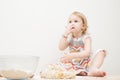 Beautiful little girl learns to cook a meal in the kitchen Royalty Free Stock Photo