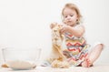 Beautiful little girl learns to cook a meal in the kitchen Royalty Free Stock Photo