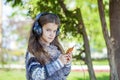 Beautiful little girl listening to music on headphones Royalty Free Stock Photo