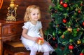 Beautiful little girl near festive christmas tree Royalty Free Stock Photo