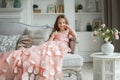 Beautiful little girl in pink dress at home Royalty Free Stock Photo