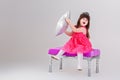 Beautiful little girl in pink Princess dress with crown sitting Royalty Free Stock Photo