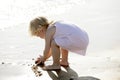 Beautiful little girl playing on the beach