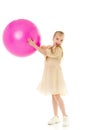 Little girl plays with a big ball for fitness Royalty Free Stock Photo