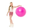 Little girl plays with a big ball for fitness Royalty Free Stock Photo